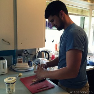 Hubby helping in the kitchen, removing chicken skin :)